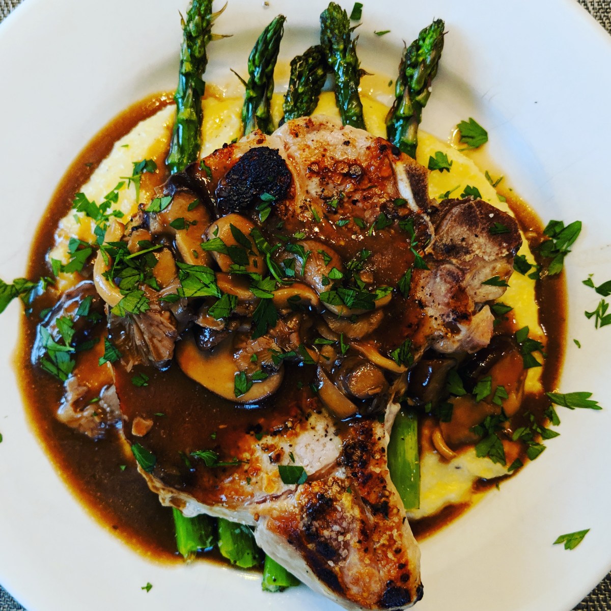 Pork Chops, Roasted Asparagus, Pecorino Romano Grits and Mushroom Gravy