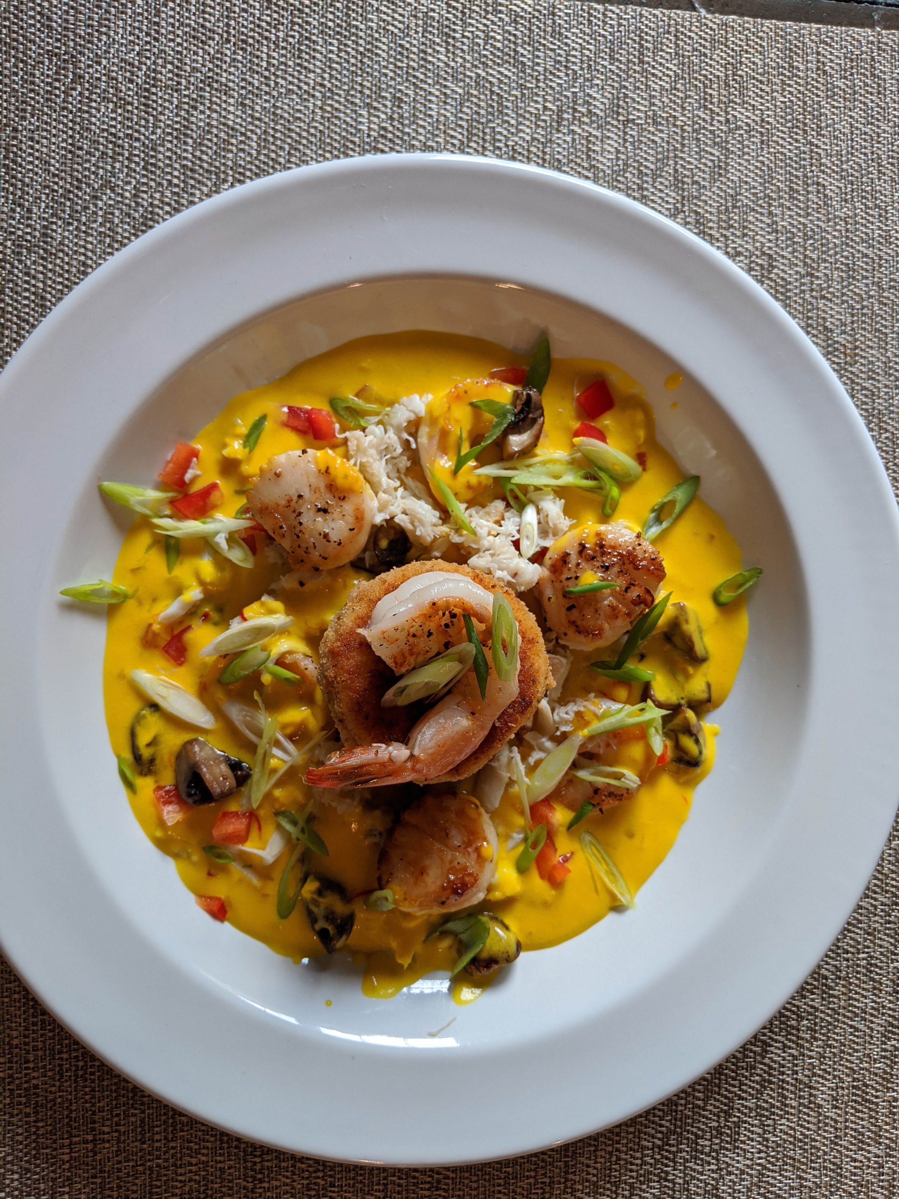 Scallops, Shrimp, Polenta Cakes with Shellfish Saffron Cream Sauce from the top