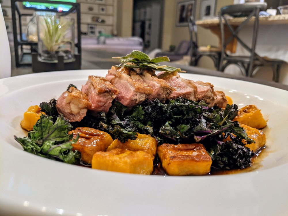 Pan Seared Duck Breast, Charred Purple Kale, Sweet Potato Gnocchi, Brown Butter Balsamic Sauce with Duck fat Fried Sage.night_