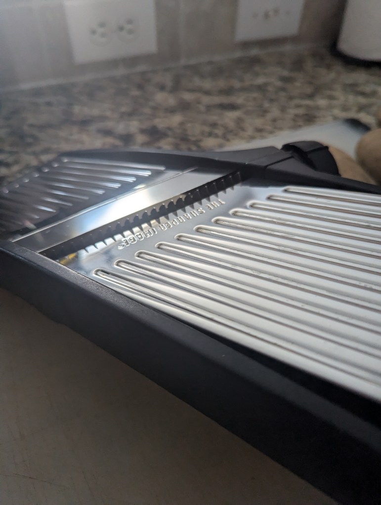 Mandolin, skinny fry setting.Mandolin, skinny fry setting.