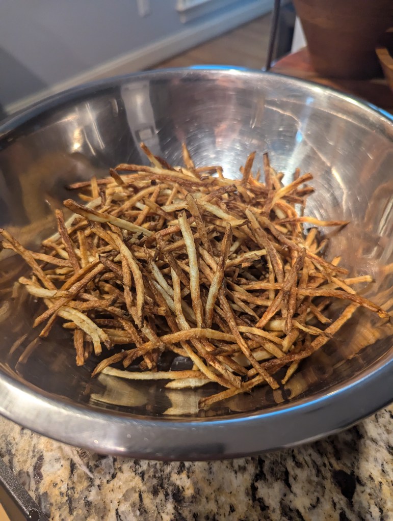 Two batches of Duck Fat Skinny Fries with Truffle Sea Salt.