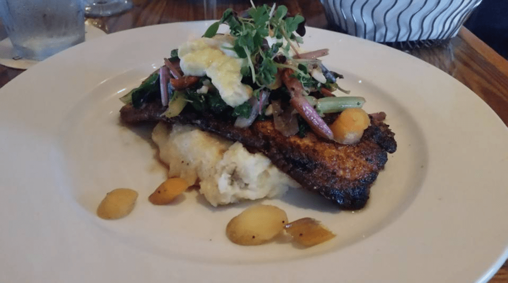 Pan Roasted Artic Char Oscar, Sauteed Local Rainbow Chard, Local Carrots, Smashed Potatoes and Citrus Crab Hollandaise.