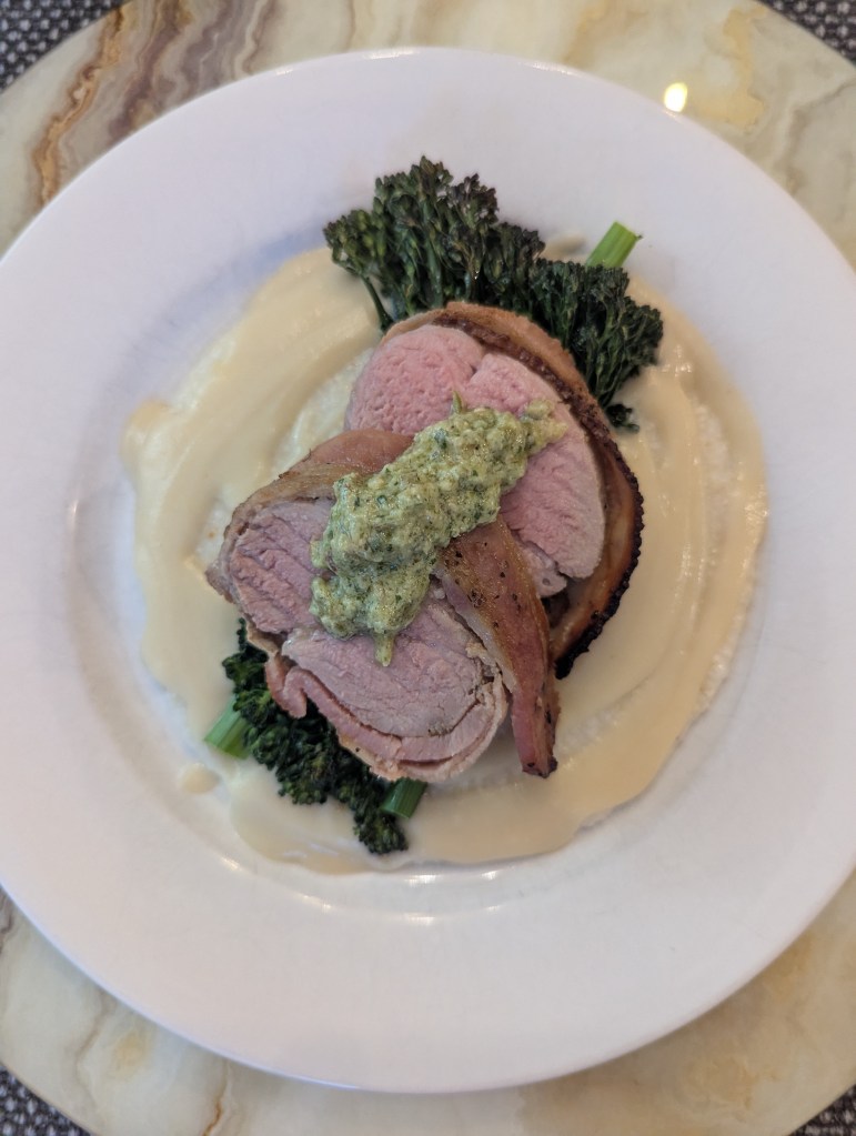 Sous Vide Bacon Wrapped Pork Tenderloin, Grits, Broccolini, Habanero Cream with Charred Scallion and Almond Pesto - Top